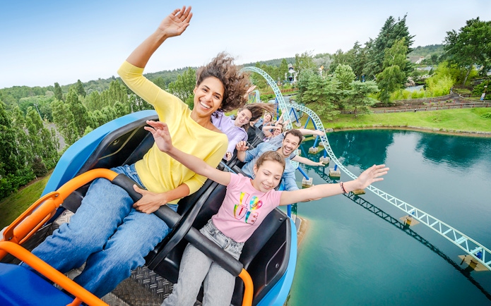 Visitors enjoying a roller coaster ride at Parc Asterix, France.
