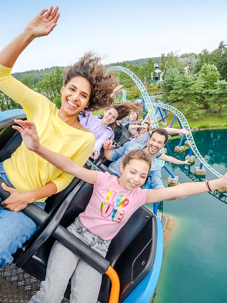 Visitors enjoying a roller coaster ride at Parc Asterix, France.