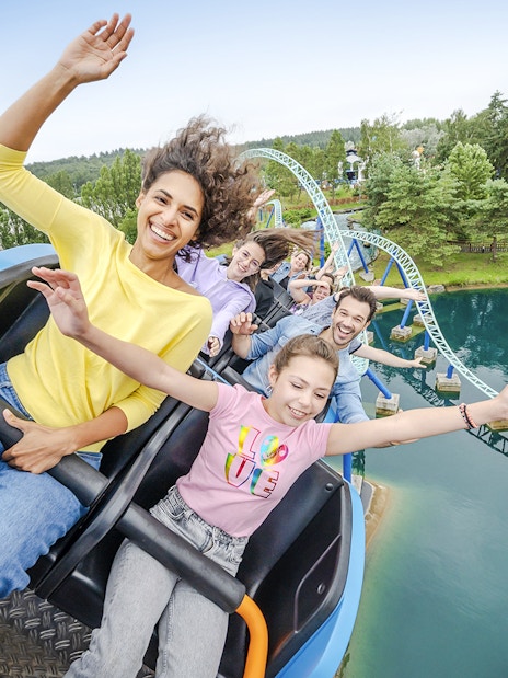 Visitors enjoying a roller coaster ride at Parc Asterix, France.