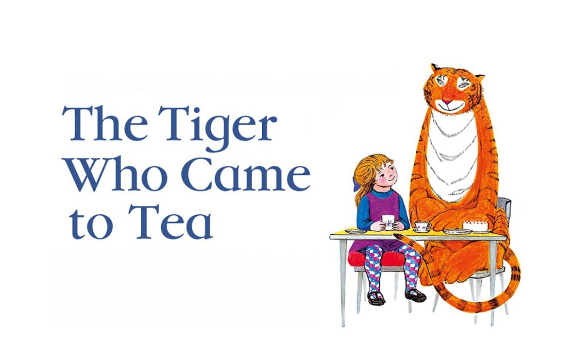Girl having tea with a tiger at a table, from "The Tiger Who Came to Tea.
