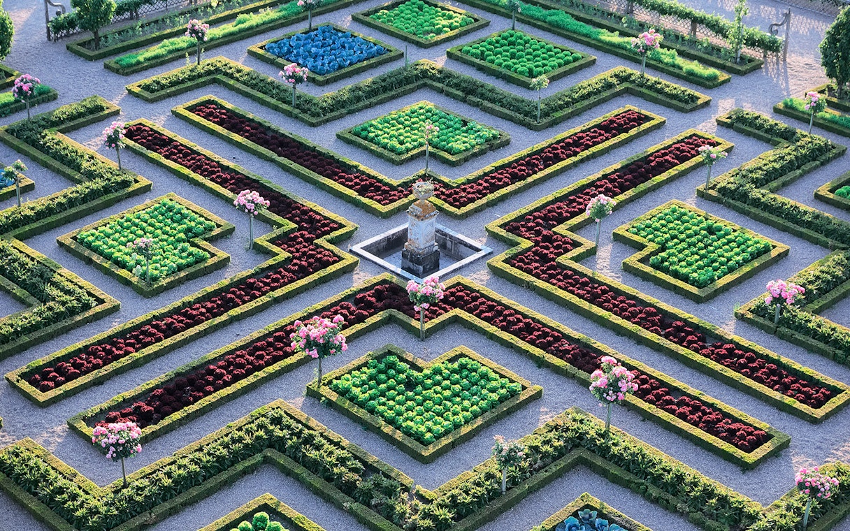 Maze Garden at Château of Villandry with geometric hedges and colorful flower beds.