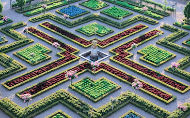 Maze Garden at Château of Villandry with geometric hedges and colorful flower beds.