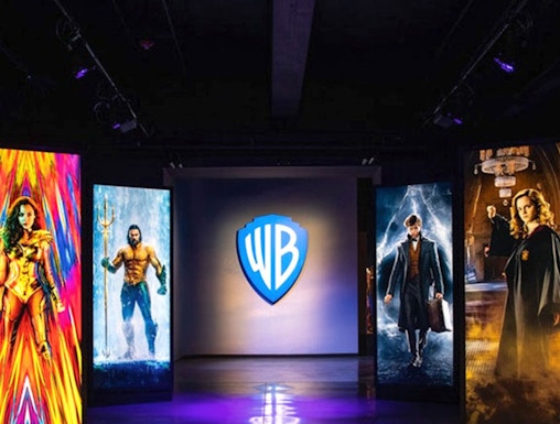 Warner Bros. Studio Tour Hollywood entrance with superhero and wizard displays.