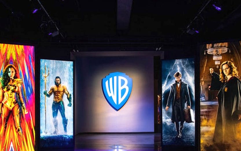 Warner Bros. Studio Tour Hollywood entrance with superhero and wizard displays.