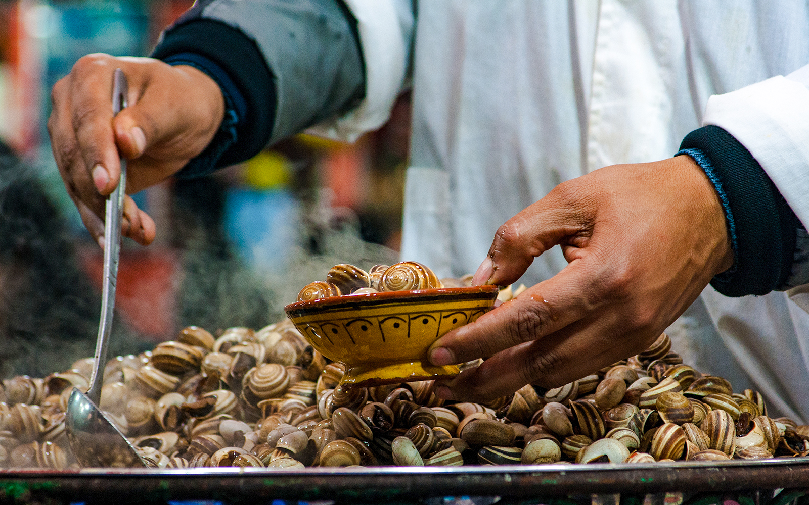 Snails being served at a street food stall in Jema el Fna, Marrakesh.