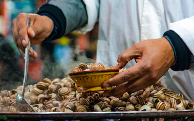 Snails being served at a street food stall in Jema el Fna, Marrakesh.