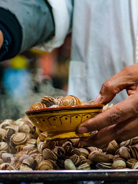 Snails being served at a street food stall in Jema el Fna, Marrakesh.