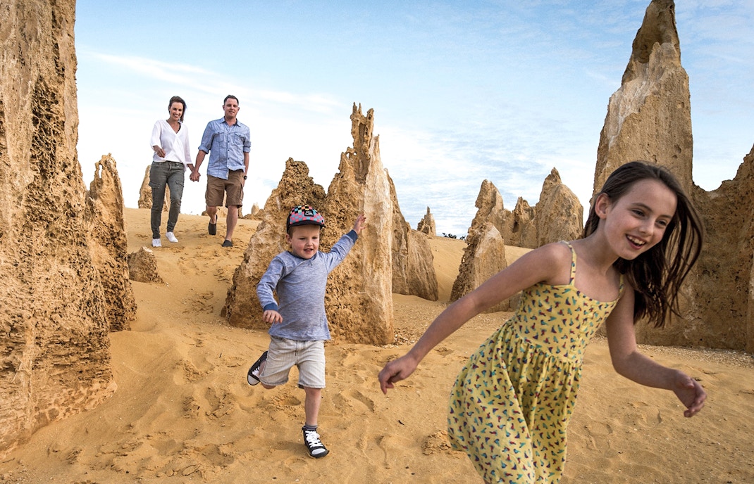Family exploring Pinnacles Desert on a guided tour from Perth.