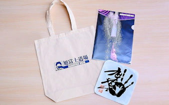 Koto City: Sumo show merchandise including tote bag and poster from Asahifuji Dojo.