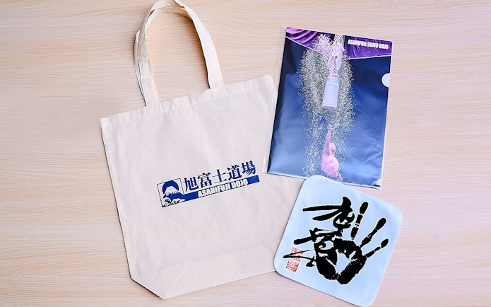 Koto City: Sumo show merchandise including tote bag and poster from Asahifuji Dojo.