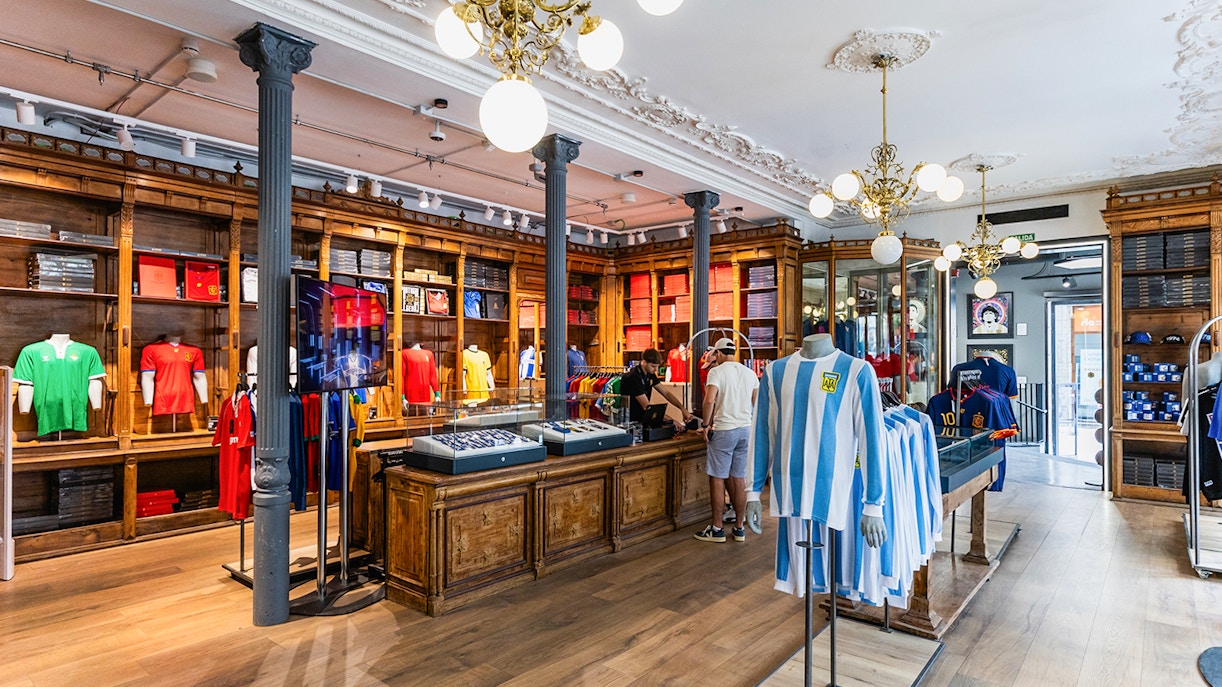 Visitors exploring the LEGENDS The Home of Football Store, showcasing a wide variety of football memorabilia and merchandise