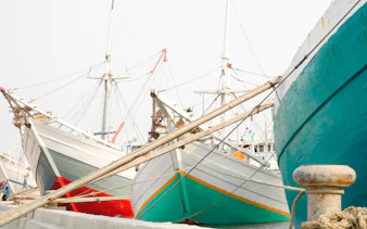 Traditional wooden ships docked at Sunda Kelapa Harbor, Jakarta.