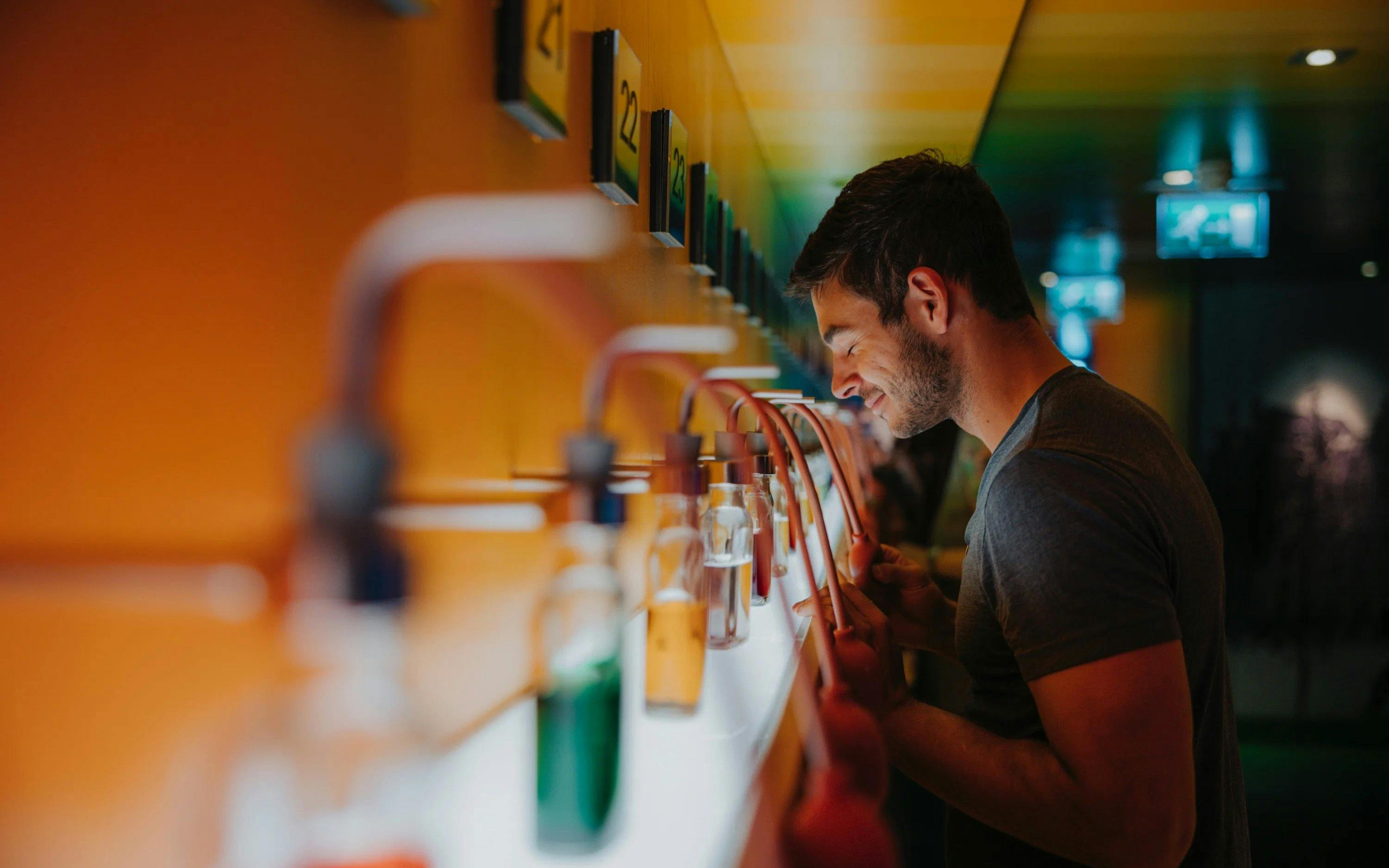 Man enjoying scents at a cocktail making workshop.