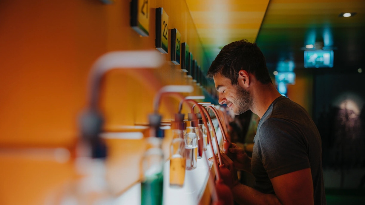 Man enjoying scents at a cocktail making workshop.