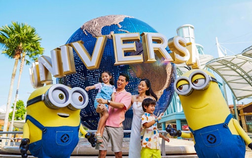 Family with Minions at Universal Studios Singapore entrance.