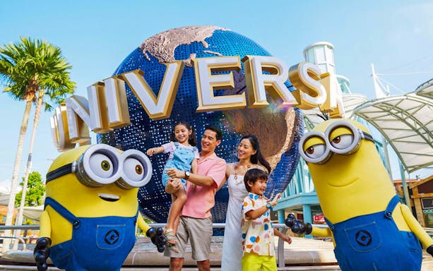 Family with Minions at Universal Studios Singapore entrance.