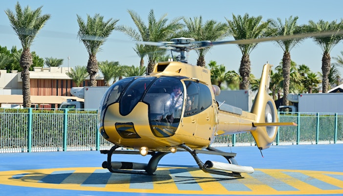 Helicopter on helipad ready for Dubai aerial tour.