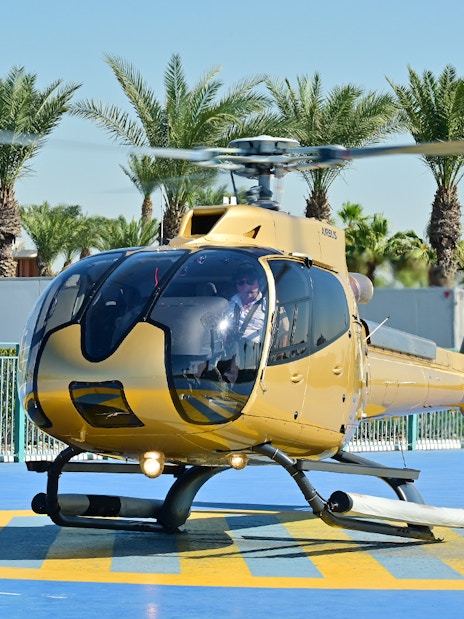 Helicopter on helipad ready for Dubai aerial tour.