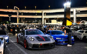 Car enthusiasts gather at Daikoku PA for Tokyo Drift JDM Culture Tour with Liberty Walk.