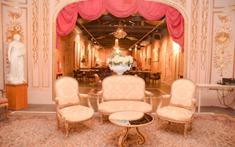 Elegant interior of Rio Scenarium with vintage furniture and ornate decor, Rio de Janeiro.