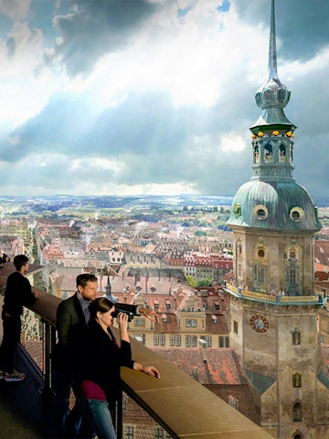 Tourists viewing Dresden skyline from Frauenkirche dome, Germany.
