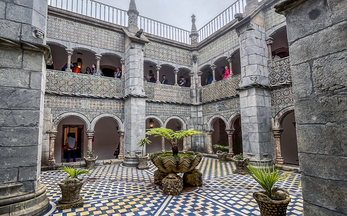 Manueline cloister with tiled walls and arches at Pena Palace, Sintra.