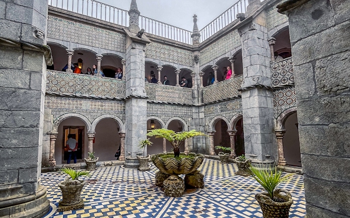 Manueline cloister with tiled walls and arches at Pena Palace, Sintra.