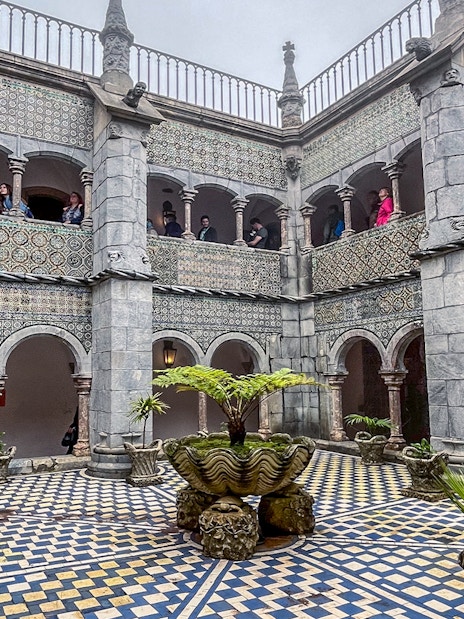 Manueline cloister with tiled walls and arches at Pena Palace, Sintra.