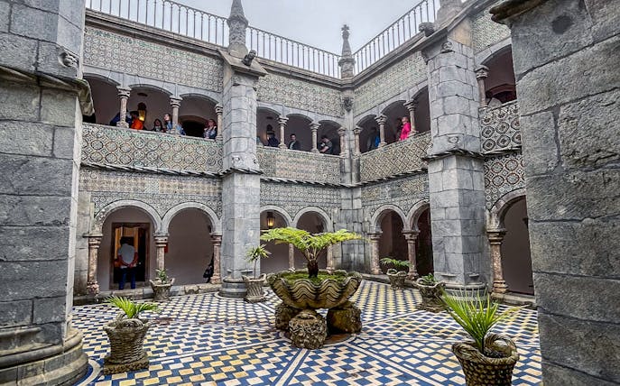 Manueline cloister with tiled walls and arches at Pena Palace, Sintra.