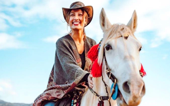 Guest riding a horse during sunrise tour in Cappadocia.