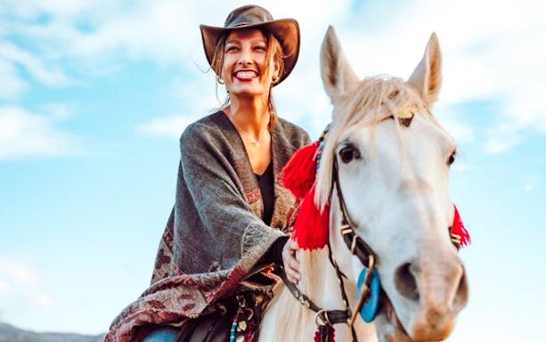 Guest riding a horse during sunrise tour in Cappadocia.