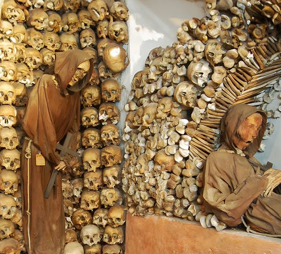 Monk skeletons and skulls in Rome's Capuchin Crypt, Italy.