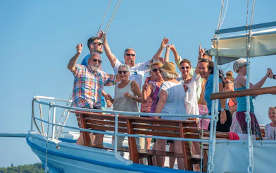 Group enjoying a boat tour to Elaphite Islands near Dubrovnik.