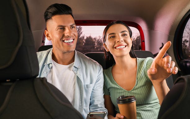 Couple enjoying private car transfer from Singapore Changi Airport.