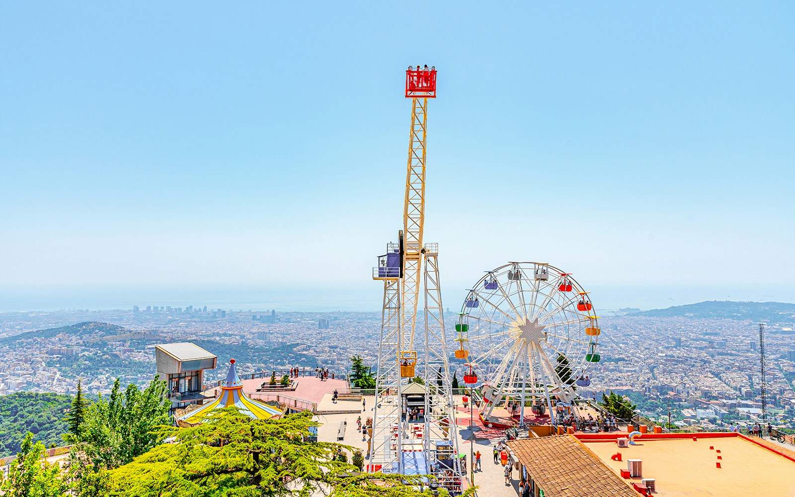 Tibidabo amusement park with Ferris wheel overlooking Barcelona, Spain.