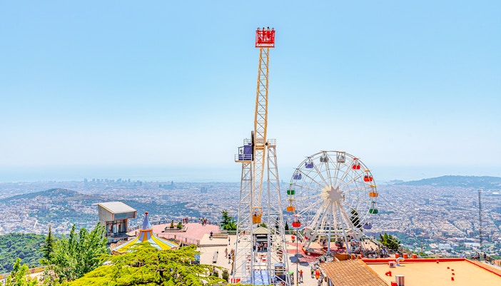 Tibidabo amusement park with Ferris wheel overlooking Barcelona, Spain.
