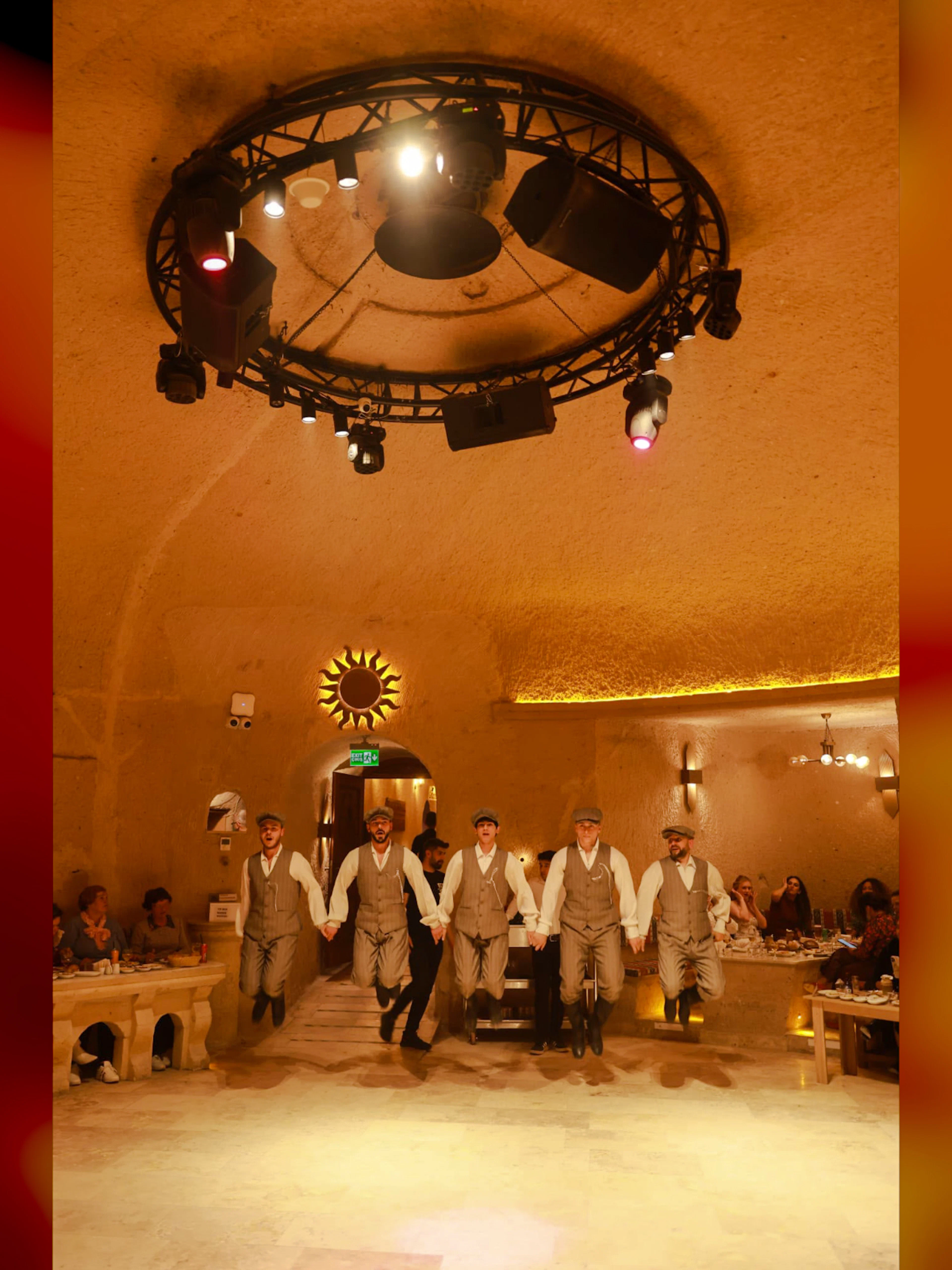 Traditional dancers performing at Cappadocia Turkish Night Show with dinner and drinks.