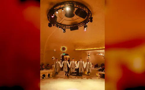 Traditional dancers performing at Cappadocia Turkish Night Show with dinner and drinks.