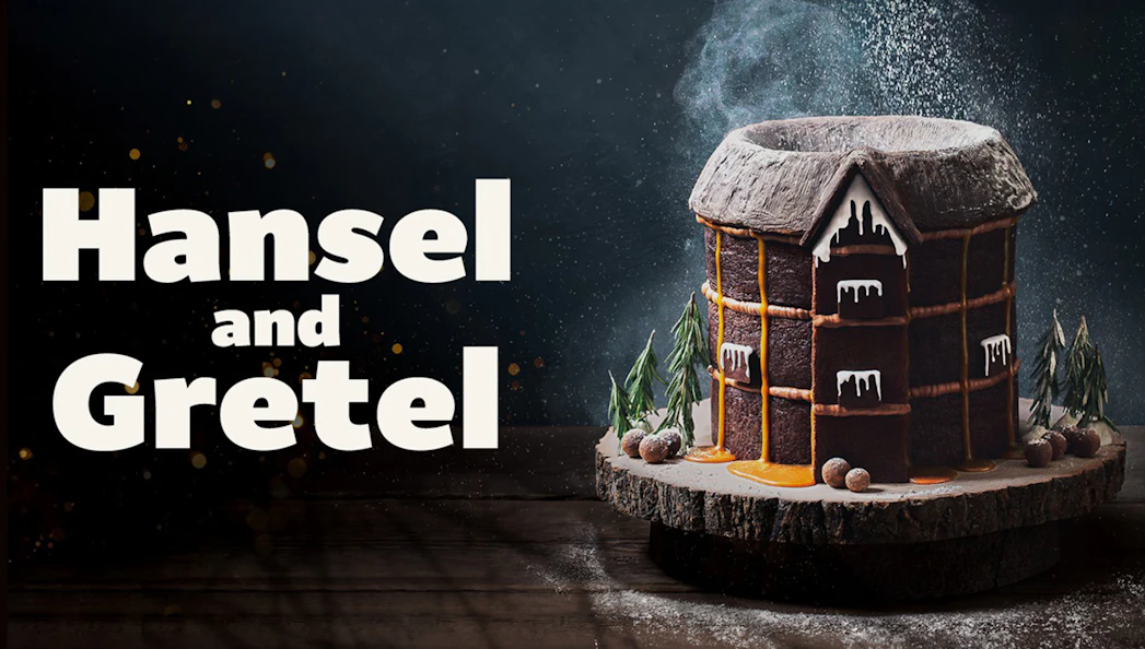 Hansel and Gretel gingerbread house with icing and candy decorations.