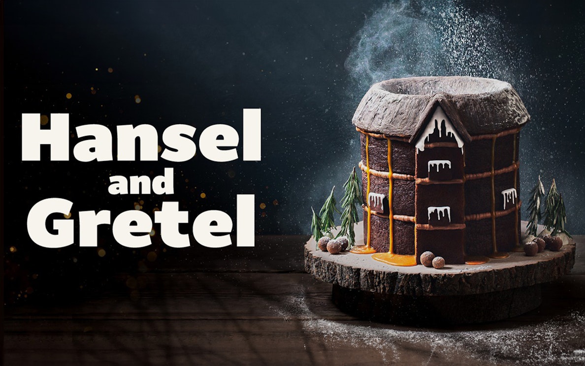 Hansel and Gretel gingerbread house with icing and candy decorations.