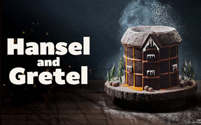Hansel and Gretel gingerbread house with icing and candy decorations.