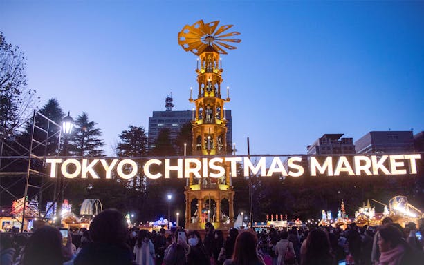 Tokyo Christmas Market 2024 at Jingu Gaien with illuminated sign and festive stalls.