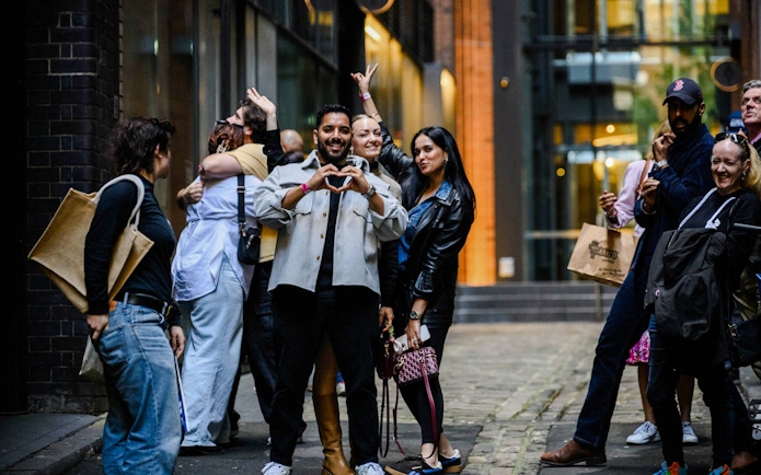 Group enjoying Sydney Comedy Festival street performance.