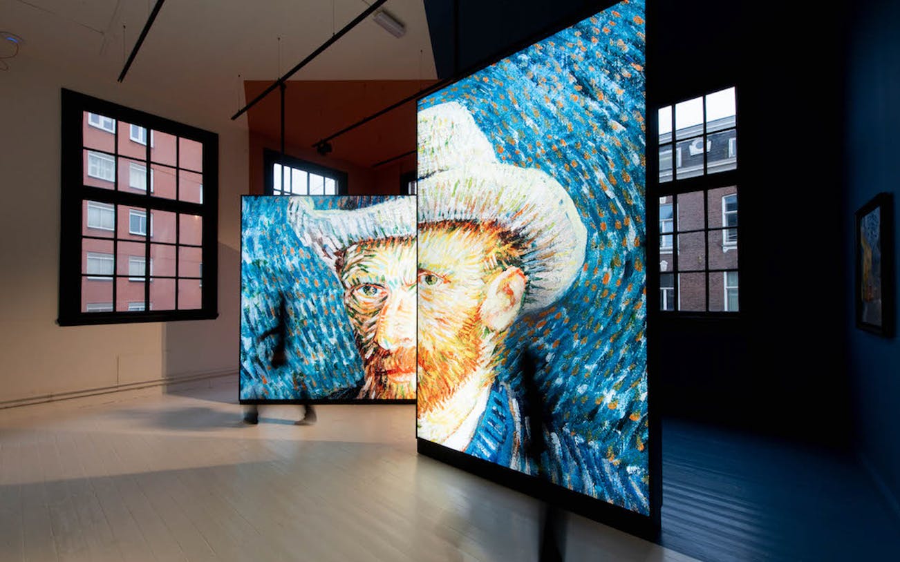 Van Gogh digital art display in Amsterdam gallery.