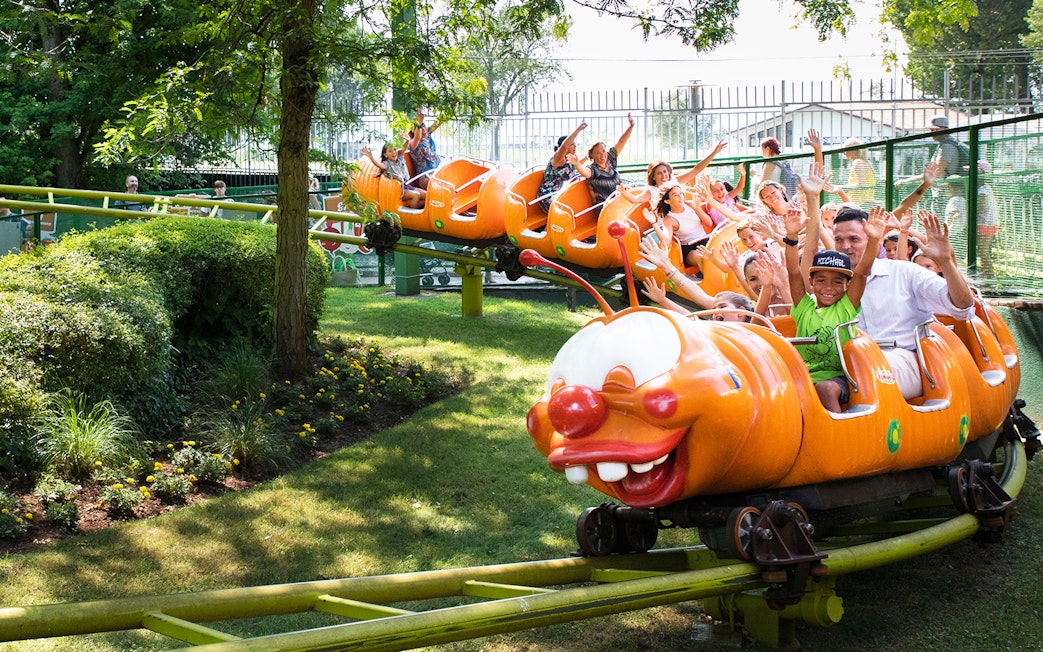Children enjoying a caterpillar ride at Gardaland Park.