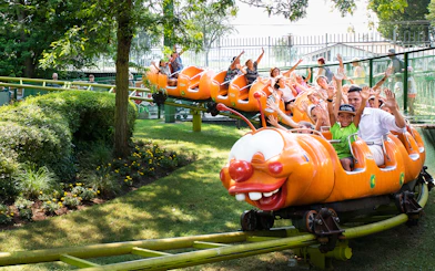 Children enjoying a caterpillar ride at Gardaland Park.