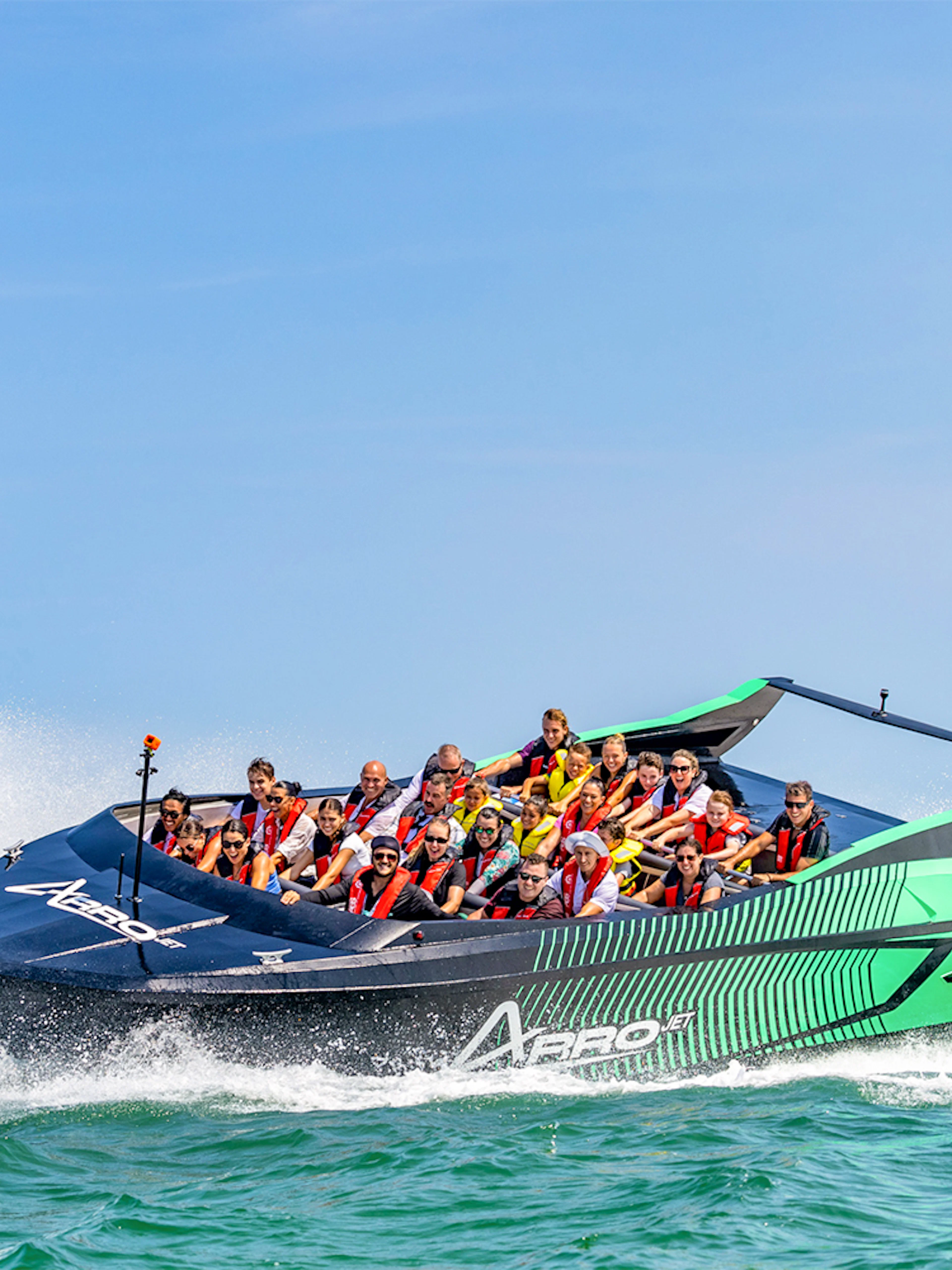 Arro Jet Boat speeding through Gold Coast Broadwater with passengers.