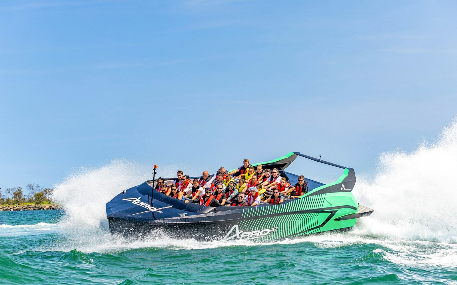 Arro Jet Boat speeding through Gold Coast Broadwater with passengers.