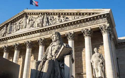 Assemblée Nationale building facade with statues, Paris, France.