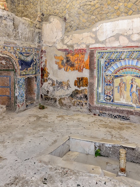 Ancient frescoes and mosaics in a room at Herculaneum, part of the Pompeii & Herculaneum guided tour.